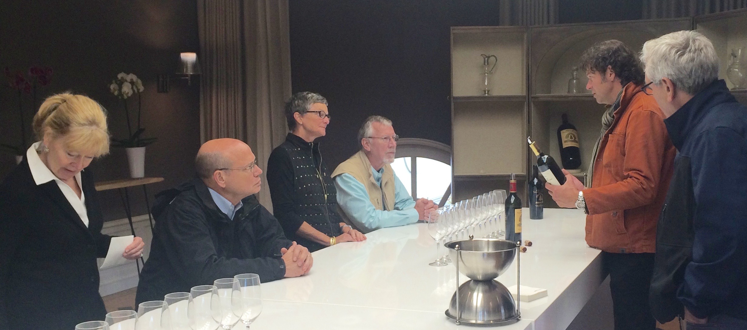 Drs. Bobbi & Dwight Oldham along with Dr. Melvin & Deborah Oakley listen as Laurent Benoit and Michel Thibault discuss Angélus wines.