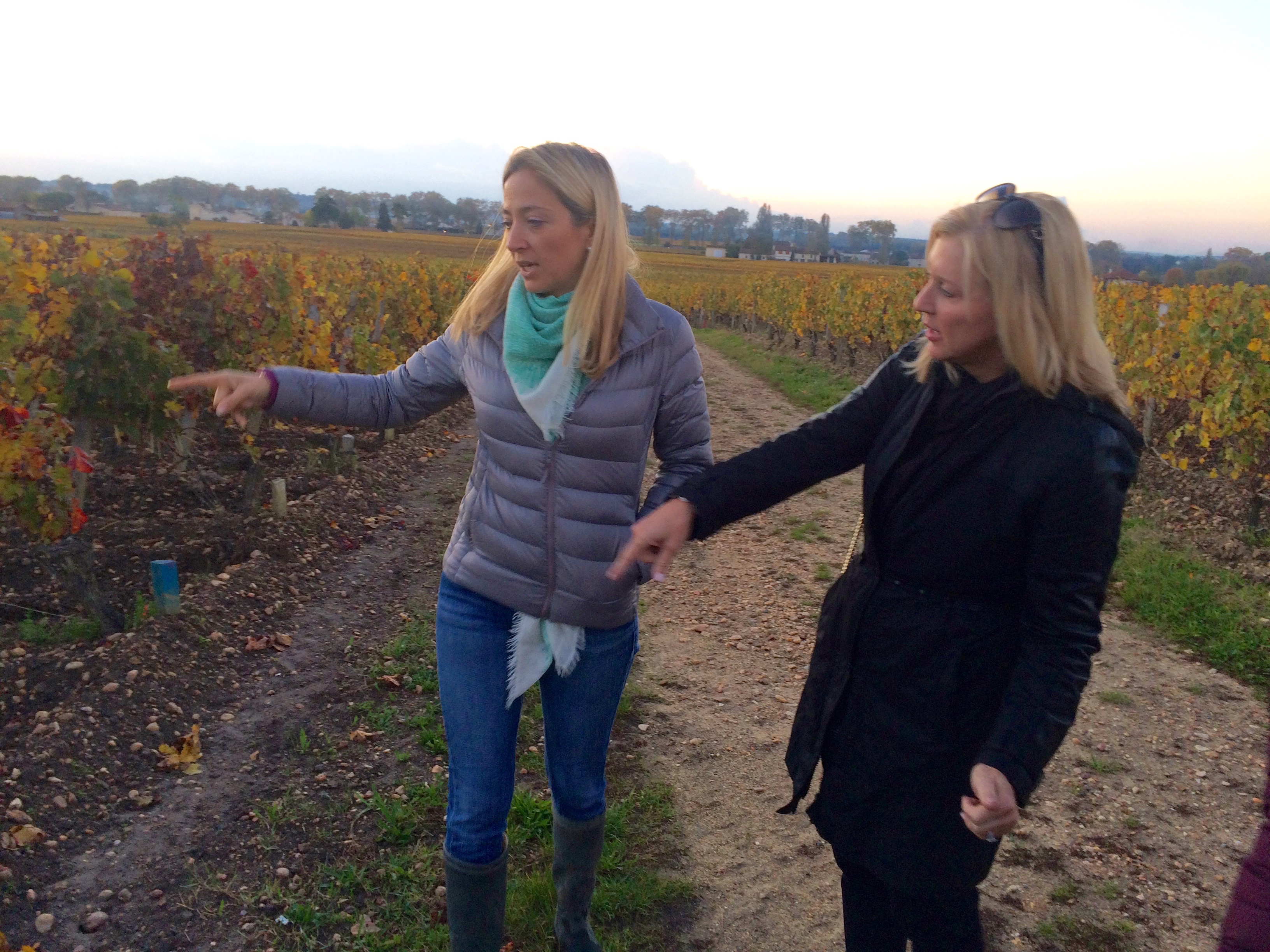 At Château Poesia, Hélène guides Deena Cossich through the vineyards, during a tour sponsored by Destin Charity Wine Auction Foundation.